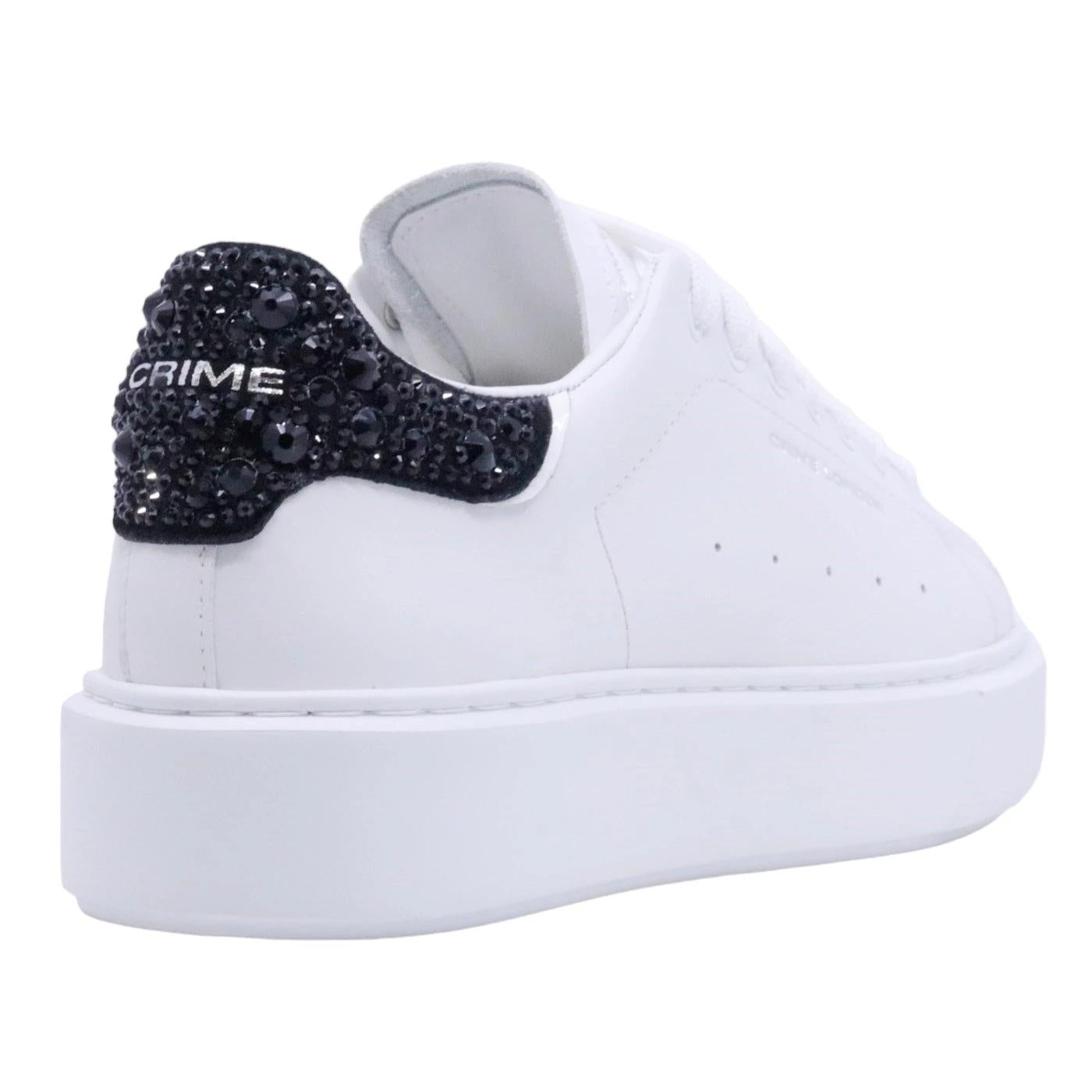 Sneaker donna Crime London in morbida pelle bianca con talloncino in glitter nero 